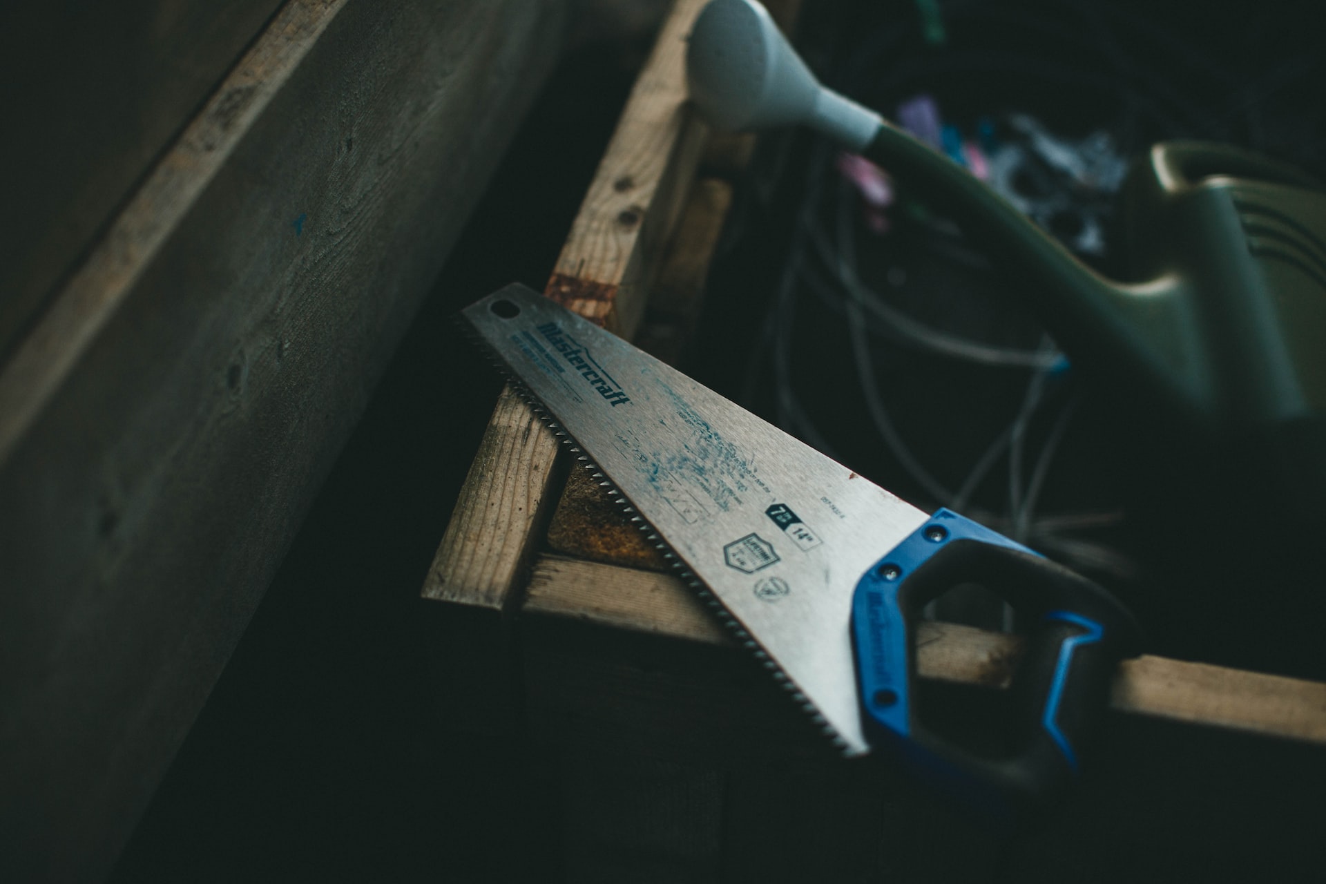 A blue hand saw for woodworking
