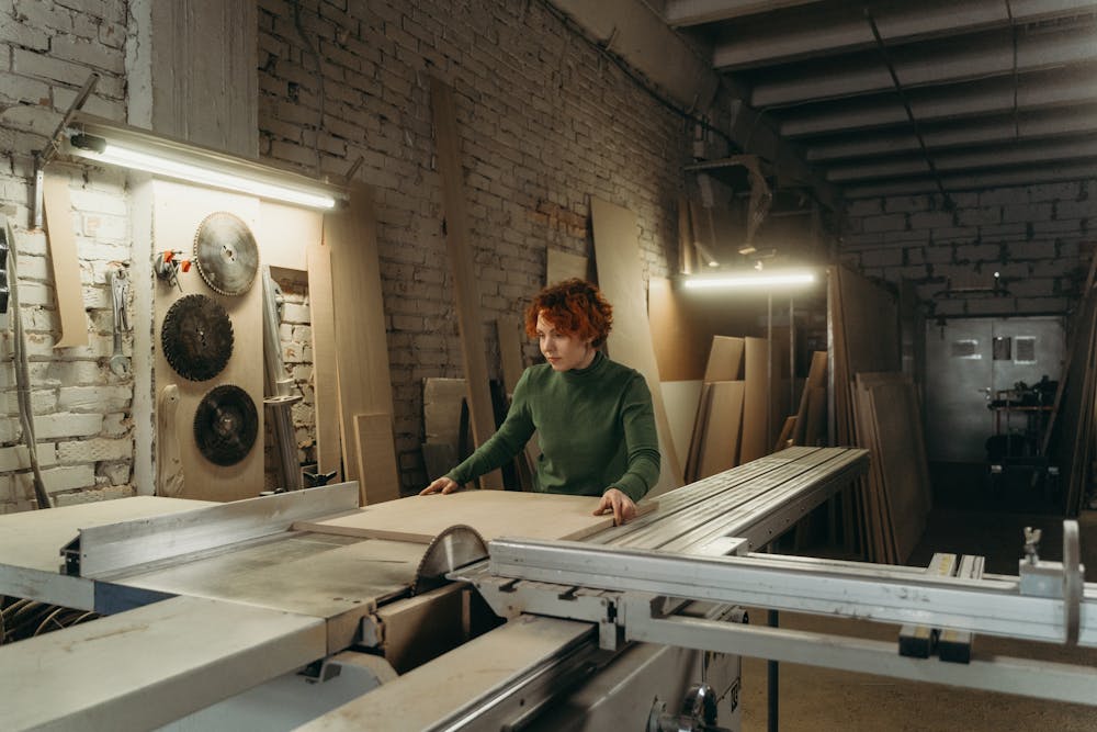 Woman operating a large power tool