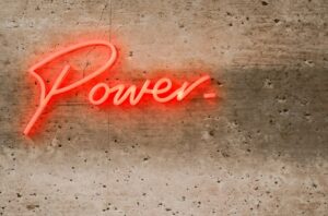 A neon sign that reads power